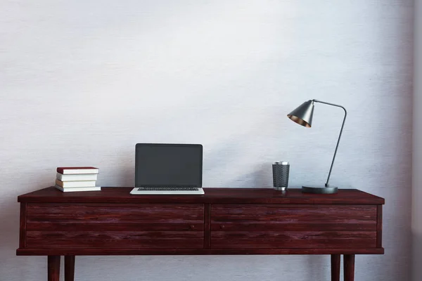 Wooden desk with empty laptop