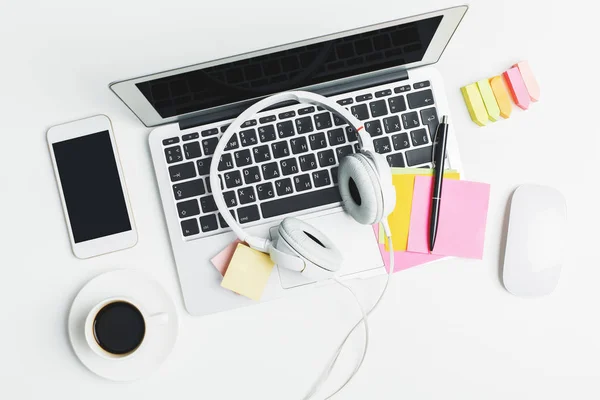 White workplace with devices and supplies