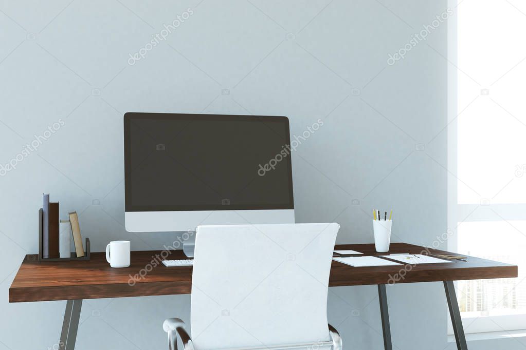 Creative designer table with empty computer 