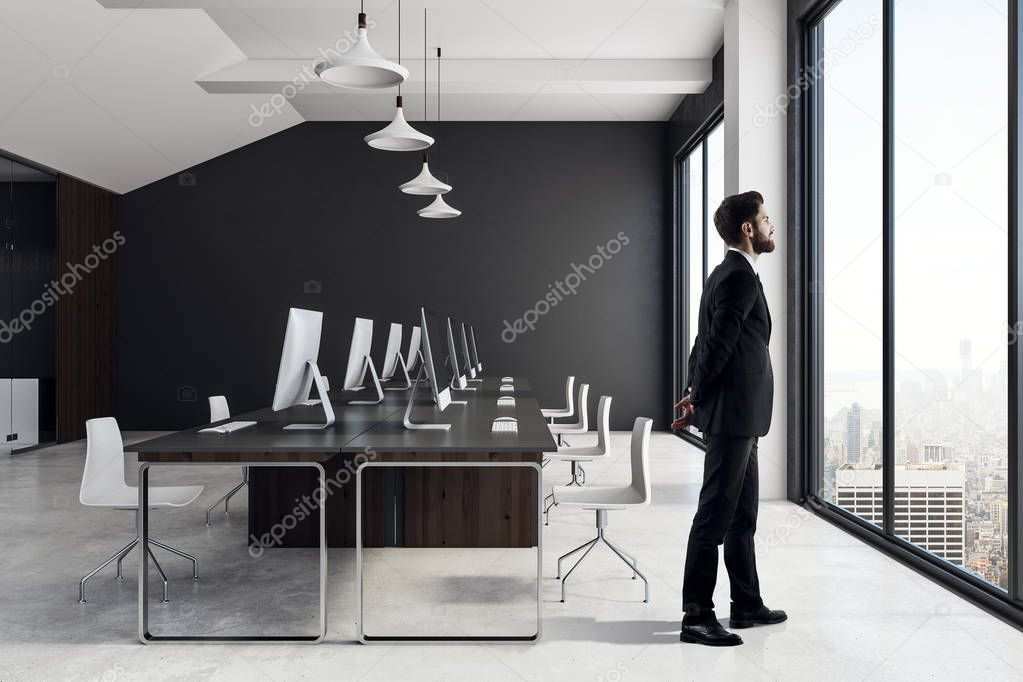 Businessman in modern coworking office interior 