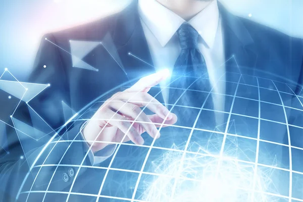 Businessman pointing at globe — Stock Photo, Image