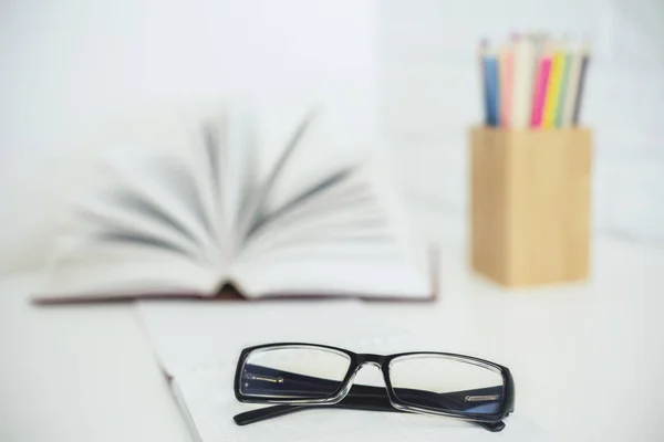 Desktop with eyeglasses — Stock Photo, Image