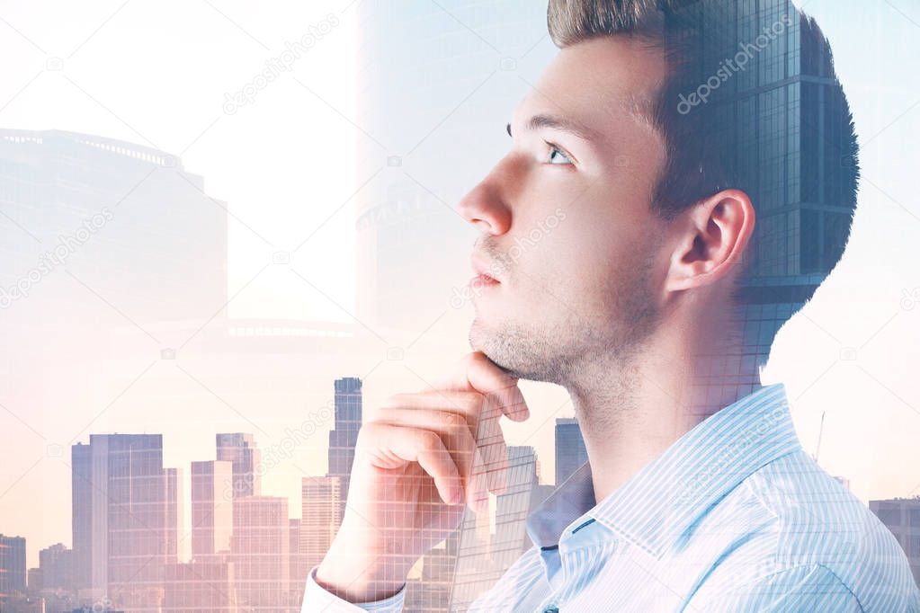 Attractive pondering man in city