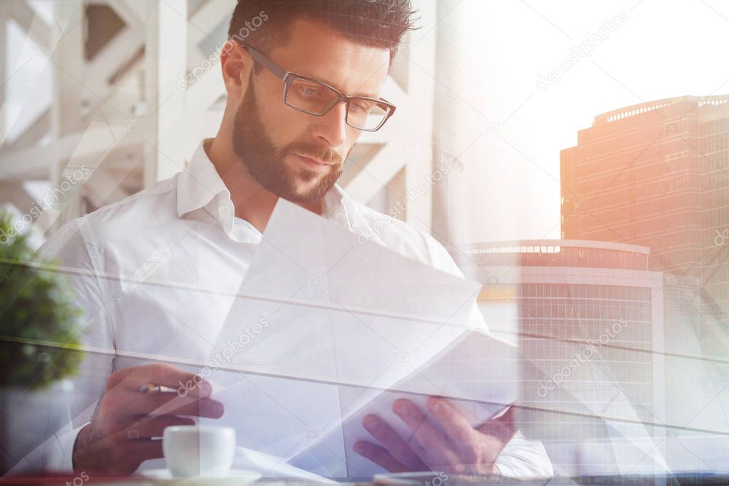 Thoughtful businessman working on project 