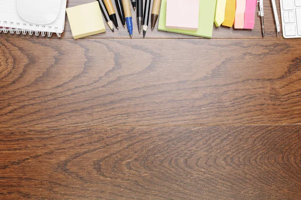 Wooden desk with supplies — Stock Photo, Image