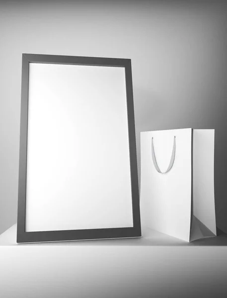 Blank shopping bag and frame — Stock Photo, Image