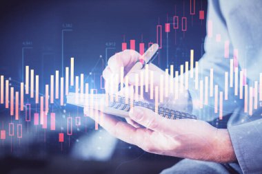 Borsa grafiği ile çift pozlama elleri.