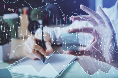 Forex tablosu WOMANS el notları arka plan alarak görüntülenir. Araştırma kavramı. Çoklu pozlama