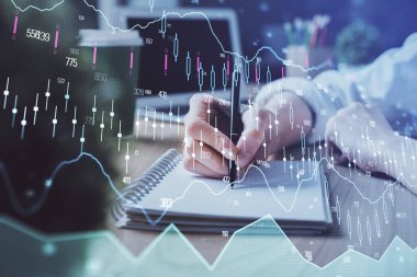 Forex tablosu WOMANS el notları arka plan alarak görüntülenir. Araştırma kavramı. Çift Pozlama