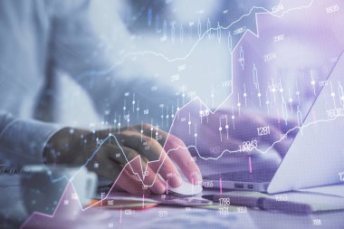 Arka planda bilgisayarda çalışan bir adamla ön x grafiğine iki kez maruz kalıyoruz. Pazar analizi kavramı.