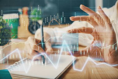 Forex tablosu WOMANS el notları arka plan alarak görüntülenir. Araştırma kavramı. Çoklu pozlama