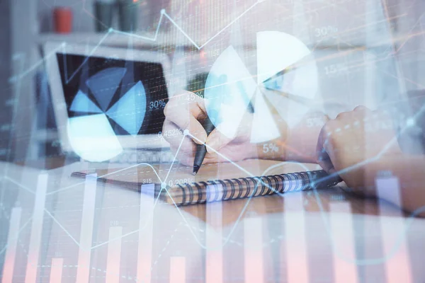 Financial graph displayed on womans hand taking notes background. Concept of research. Double exposure — Stock Photo, Image