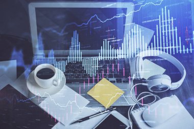 Finansal pazar grafiği hologramı ve kişisel bilgisayar arka planda. Çoklu maruz kalma. Önx kavramı.