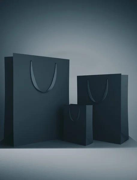 Üç siyah alışveriş çantası. — Stok fotoğraf