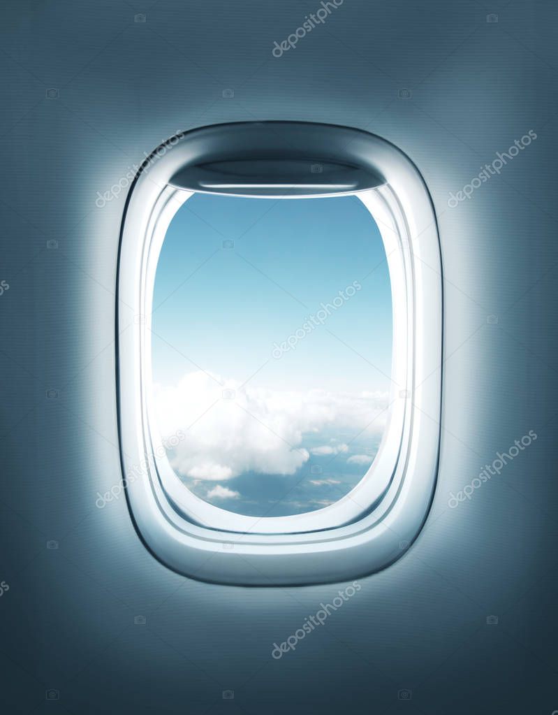 airplane window with clouds view