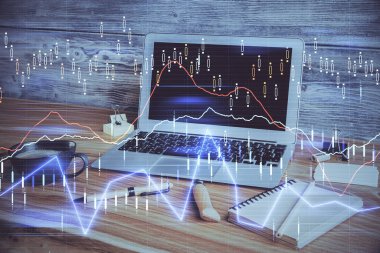 Grafik ve finansal bilgilere çifte maruz kalma ve bilgisayar geçmişi olan çalışma alanı. Uluslararası çevrimiçi ticaret kavramı.