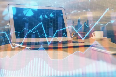 Arka planda eski pazar grafik hologramı ve kişisel bilgisayar var. Çoklu maruz kalma. Yatırım kavramı.