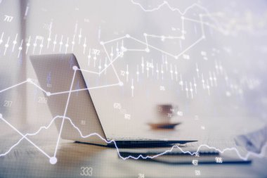 Grafik ve finansal bilgilere çifte maruz kalma ve bilgisayar geçmişi olan çalışma alanı. Uluslararası çevrimiçi ticaret kavramı.