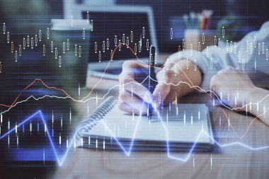 Forex tablosu WOMANS el notları arka plan alarak görüntülenir. Araştırma kavramı. Çift Pozlama