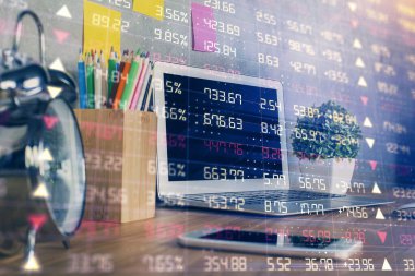Finansal tablo çizimi ve arka planda bilgisayar olan bir tablo. Çoklu maruz kalma. Uluslararası pazarlar kavramı.