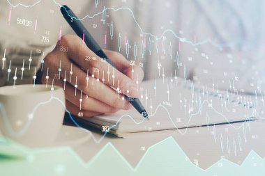 Forex tablosu WOMANS el notları arka plan alarak görüntülenir. Araştırma kavramı. Çift Pozlama