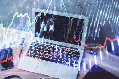 Grafik ve finansal bilgilere çifte maruz kalma ve bilgisayar geçmişi olan çalışma alanı. Uluslararası çevrimiçi ticaret kavramı.