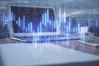 Finansal tablo çizimi ve arka planda bilgisayar olan bir tablo. Çoklu maruz kalma. Uluslararası pazarlar kavramı.