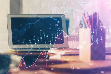 Finansal tablo çizimi ve arka planda bilgisayar olan bir tablo. Çoklu maruz kalma. Uluslararası pazarlar kavramı.