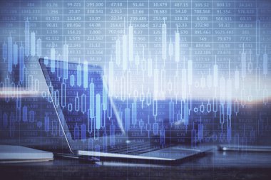 Finansal tablo çizimi ve arka planda bilgisayar olan bir tablo. Çifte maruziyet. Uluslararası pazarlar kavramı.