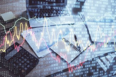 Finansal grafik renkli çizimler ve arka planda bilgisayar olan tablolar. Çifte maruziyet. Uluslararası pazarlar kavramı.