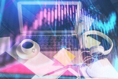 Finansal pazar grafiği hologramı ve kişisel bilgisayar arka planda. Çifte maruziyet. Önx kavramı.