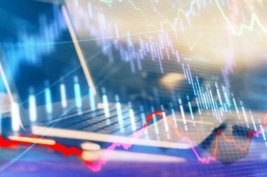 Finansal grafik renkli çizimler ve arka planda bilgisayar olan tablolar. Çifte maruziyet. Uluslararası pazarlar kavramı.