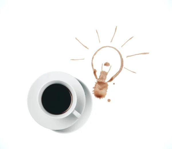 Šálek kávy a žárovka výkresu. — Stock fotografie