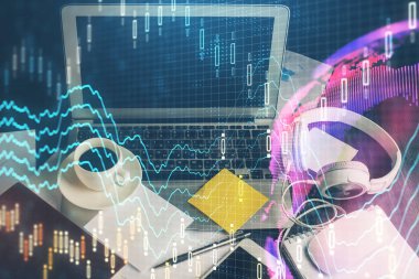 Finansal tablo çizimi ve arka planda bilgisayar olan bir tablo. Çoklu maruz kalma. Uluslararası pazarlar kavramı.