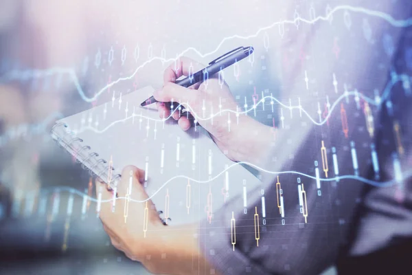 Multi exposure of hands making notes with forex chart huds. Stock market concept. — Stock Photo, Image