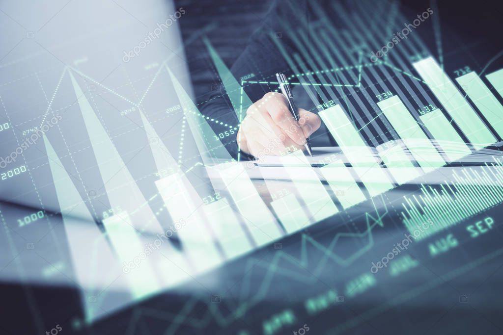 Double exposure of businessman with laptop and stock market forex chart.