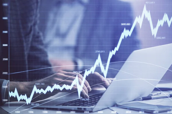Double exposure of market chart with man working on computer on background. Concept of financial analysis. — Stock Photo, Image