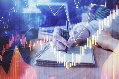 Forex tablosu WOMANS el notları arka plan alarak görüntülenir. Araştırma kavramı. Çift Pozlama