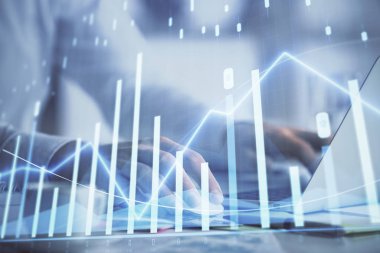 Arka planda bilgisayarda çalışan bir adamla ön x grafiğine iki kez maruz kalıyoruz. Pazar analizi kavramı.