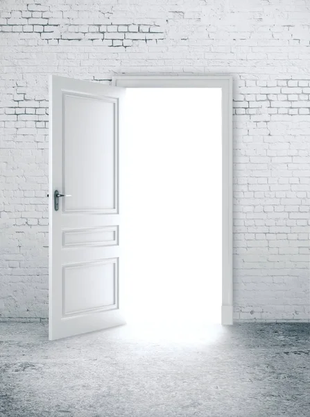 Open door in white brick wall — Stock Photo, Image