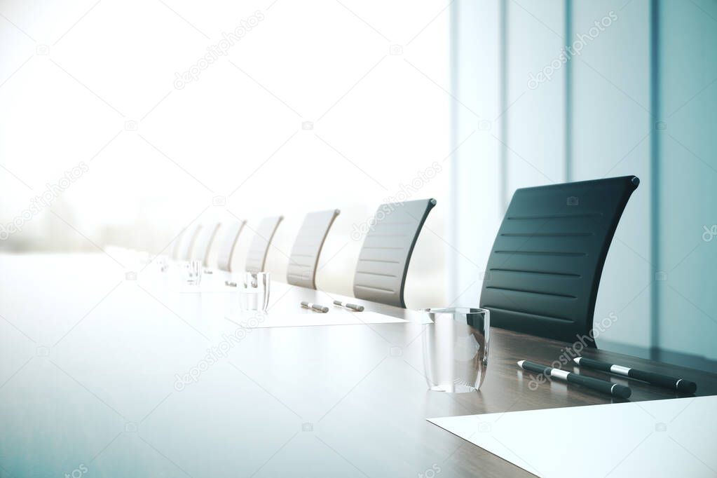 Table with equipment in conference room.