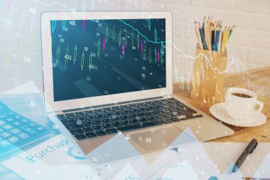 Finansal tablo çizimi ve arka planda bilgisayar olan bir tablo. Çifte maruziyet. Uluslararası pazarlar kavramı.