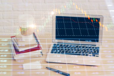 Arka planda eski pazar grafik hologramı ve kişisel bilgisayar var. Çoklu maruz kalma. Yatırım kavramı.