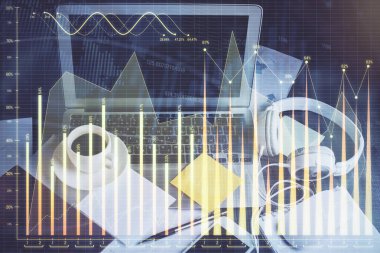 Finansal grafik renkli çizimler ve arka planda bilgisayar olan tablolar. Çifte maruziyet. Uluslararası pazarlar kavramı.