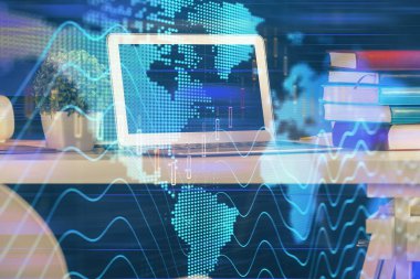 Finansal grafik renkli çizimler ve arka planda bilgisayar olan tablolar. Çoklu maruz kalma. Uluslararası pazarlar kavramı.