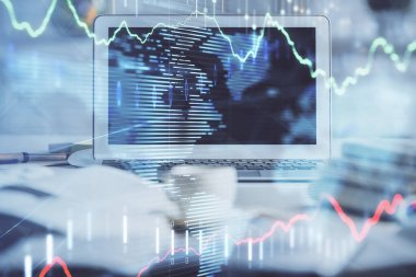 Kişisel bilgisayar arkaplanına çizilmiş borsa hologramı. Çifte maruziyet. Yatırım kavramı.