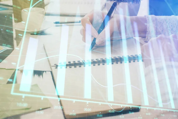 Devisendiagramm Hologramm auf der Hand unter Notizen Hintergrund. Konzept der Analyse. Doppelbelastung — Stockfoto