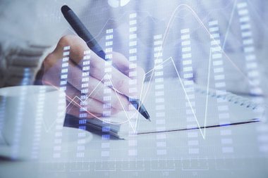 Forex tablosu WOMANS el notları arka plan alarak görüntülenir. Araştırma kavramı. Çift Pozlama