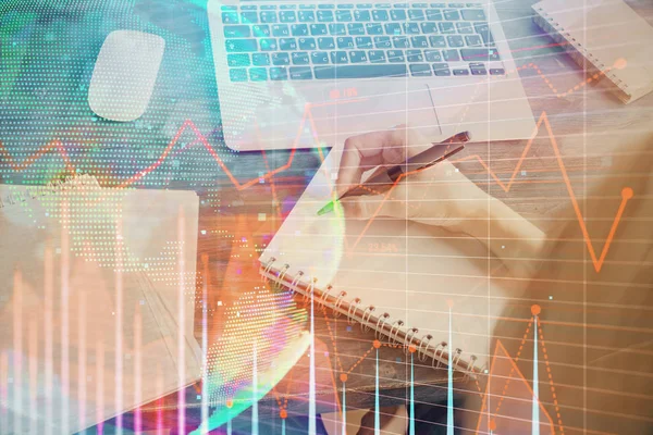 Financial graph displayed on womans hand taking notes background. Concept of research. Multi exposure — Stock Photo, Image