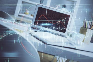 Finansal grafik renkli çizimler ve arka planda bilgisayar olan tablolar. Çifte maruziyet. Uluslararası pazarlar kavramı.